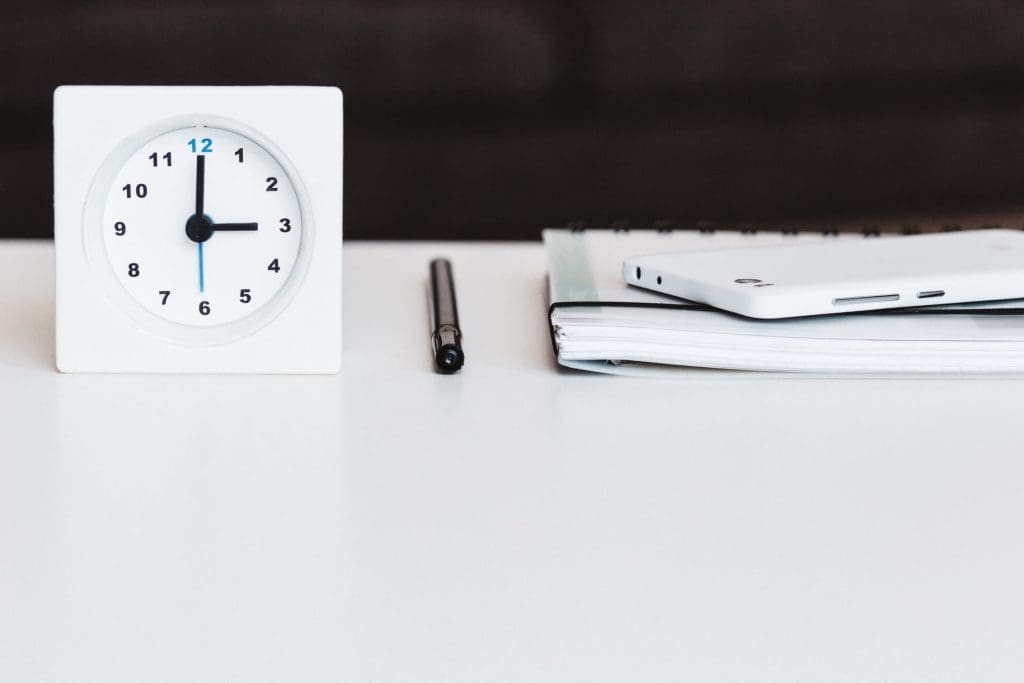 clock-on-a-white-table-