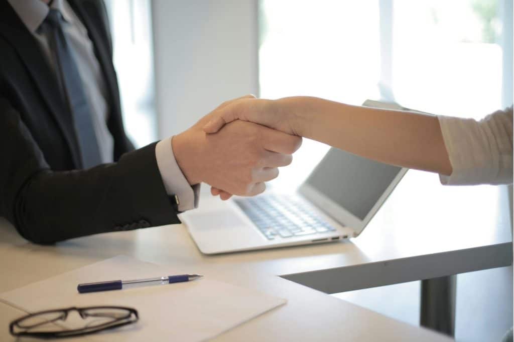 Shaking hands to symbolize partnerships in property management