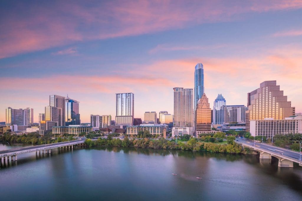 Sunset over Austin, highlighting modern and traditional architecture to represent Austin rental property.