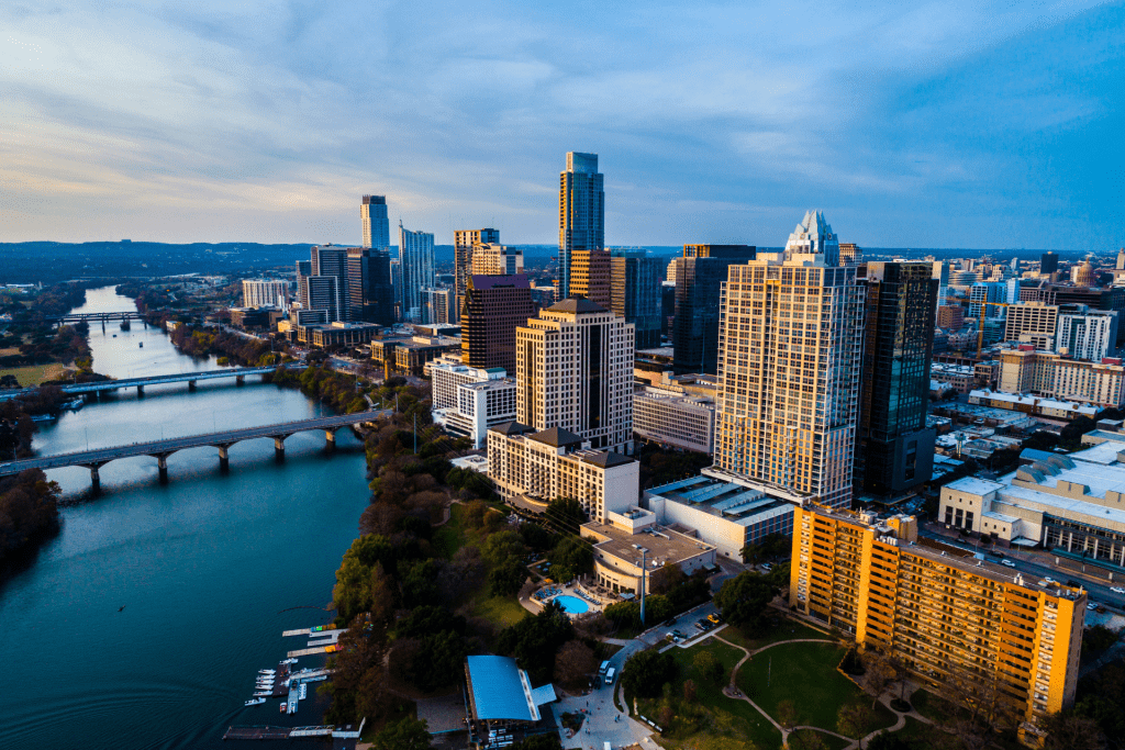 An aerial view of the Austin, Texas skyline, featuring iconic skyscrapers and vibrant cityscape, representing the growth potential of expanding your rental portfolio in this thriving market.